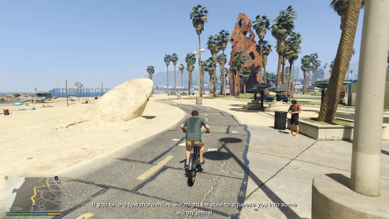 Michael rides a bicycle along Vespucci Beach while an English subtitle jokes about skinny jeans